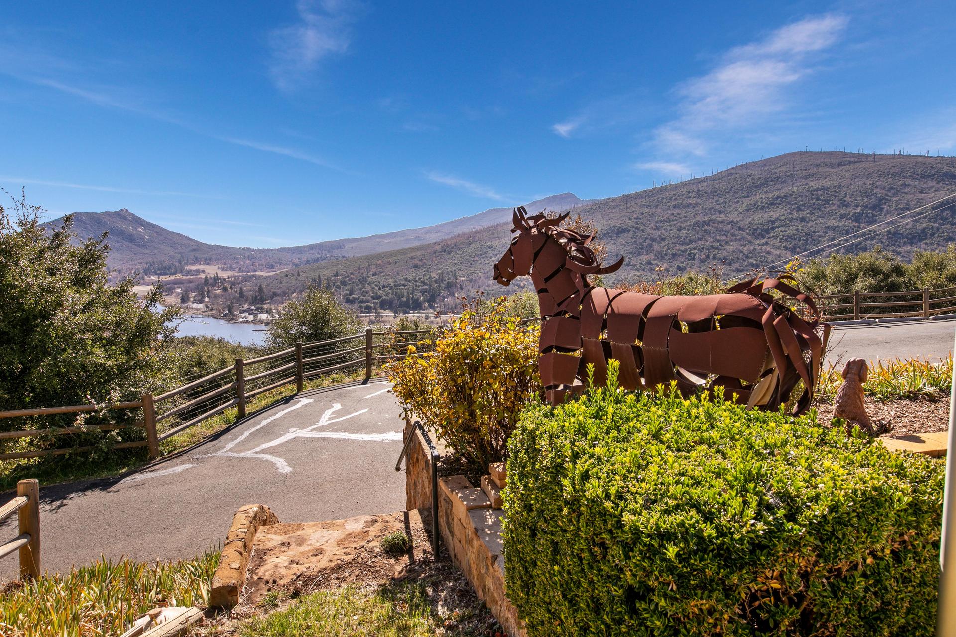Metal horse with view of lake